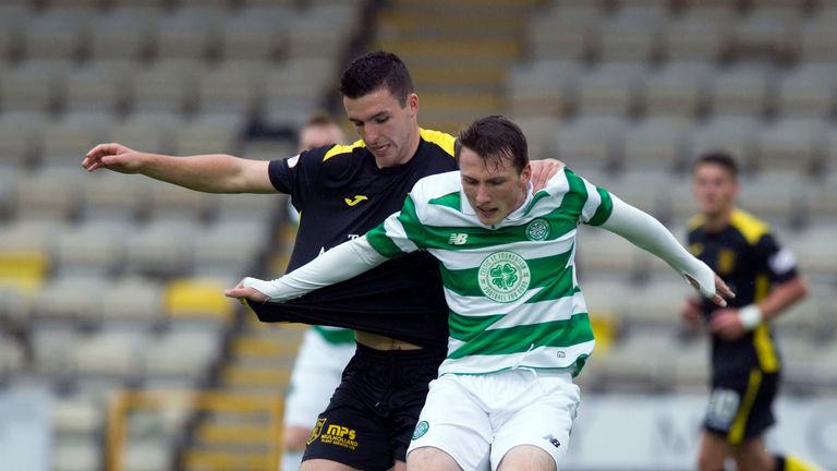 Livingston's Mikey Miller (left) battles for the ball with Regan Hendry