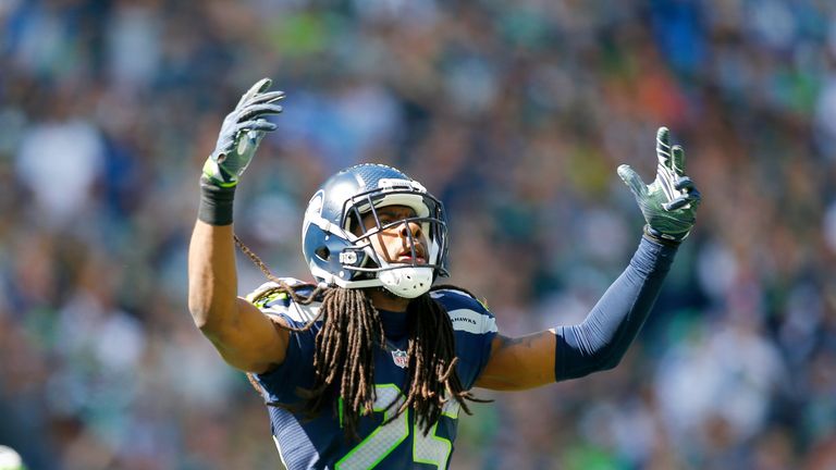 SEATTLE, WA - SEPTEMBER 11:  Cornerback Richard Sherman #25 of the Seattle Seahawks gets the crowd going against the Miami Dolphins in the first half at Ce