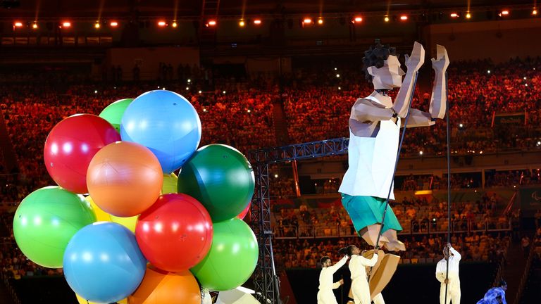 Performers entertain during the ceremony at Maracana Stadium