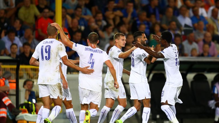 Riyad Mahrez of Leicester City celebrates with team-mates after scoring their third goal