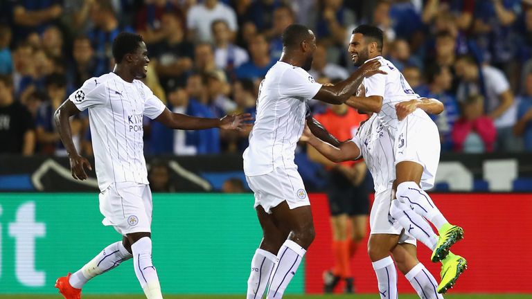 Riyad Mahrez celebrates with his Foxes team-mates after putting Leicester 2-0 up
