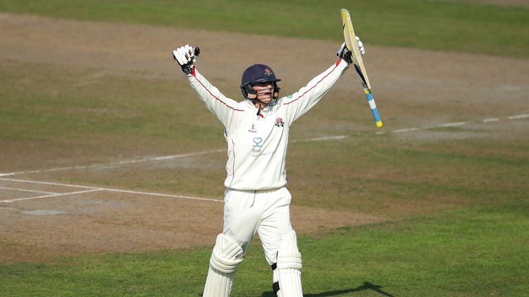 MANCHESTER, ENGLAND - SEPTEMBER 14:  Rob Jones of Lancashire celebrates his maiden first-class century during day three of the Specsavers County Championsh