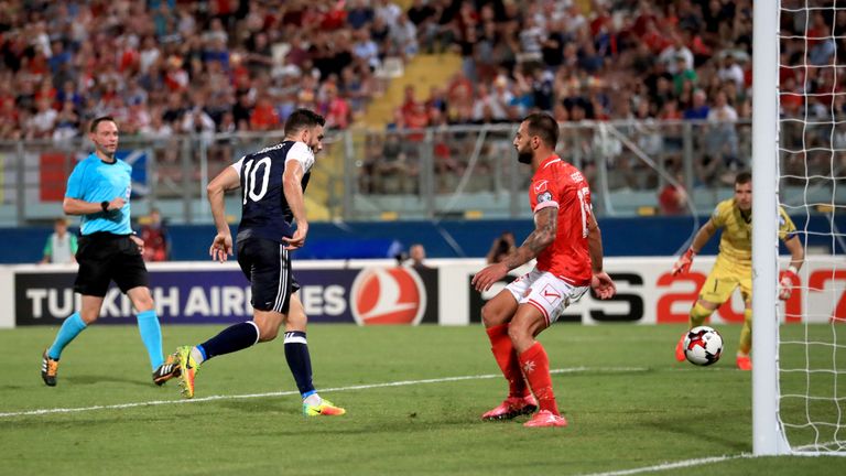 Scotland's Robert Snodgrass scores his side's fifth goal and completes his hat-trick
