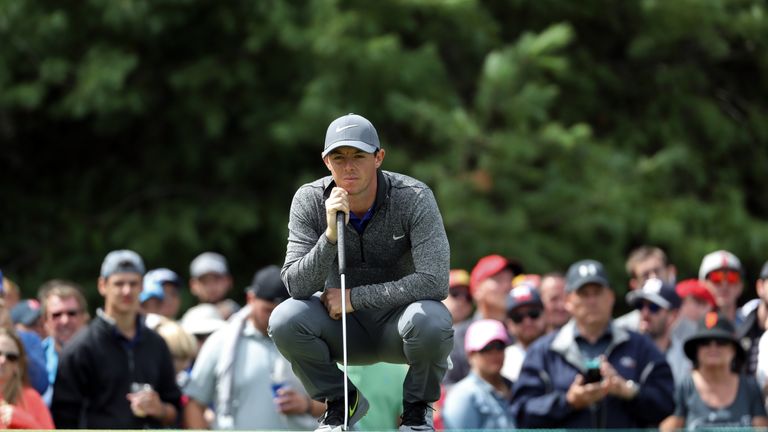 NORTON, MA - SEPTEMBER 05:  Rory McIlroy of Northern Ireland lines up a putt on the 14th green during the final round of the Deutsche Bank Championship at 