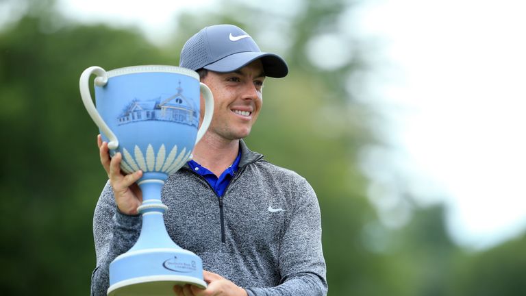 Rory McIlroy celebrates with his trophy