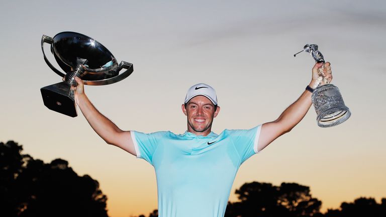 ATLANTA, GA - SEPTEMBER 25:  Rory McIlroy of Northern Ireland poses with the FedExCup and TOUR Championship trophies after his victory over Ryan Moore with