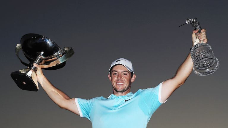 ATLANTA, GA - SEPTEMBER 25:  Rory McIlroy of Northern Ireland poses with the FedExCup and TOUR Championship trophies after his victory over Ryan Moore with