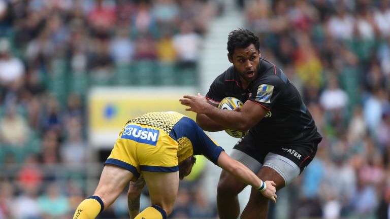 Billy Vunipola is tackled by Worcester's Ryan Lamb