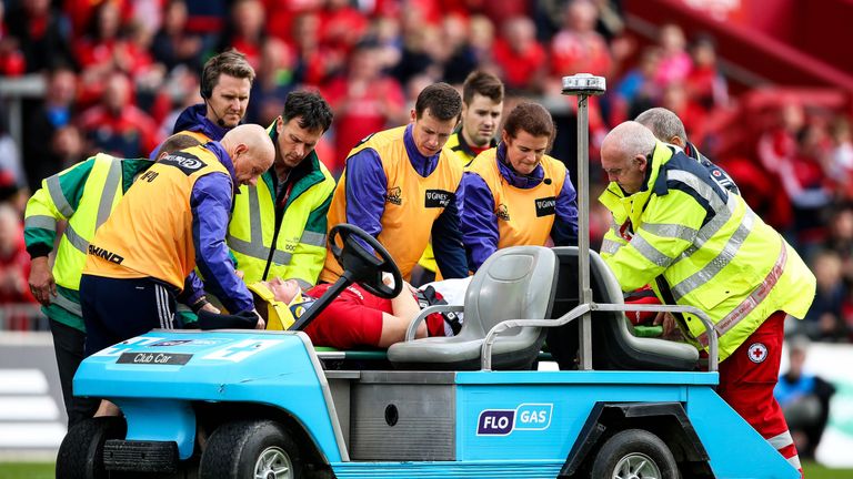 Jack O'Donoghue is stretchered off following a collision with Fraser McKenzie