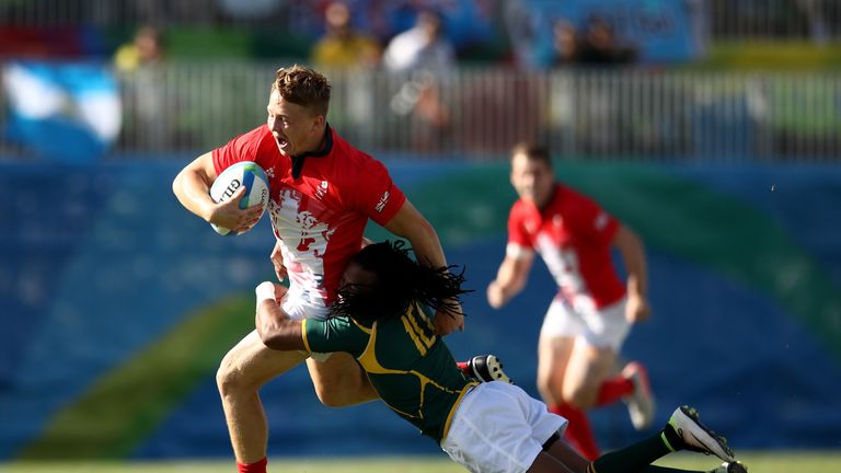 James Davies of Great Britain is tackled by Cecil Afrika of South Africa at the Rio Olympics