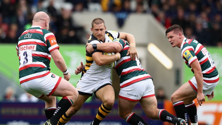 Jimmy Gopperth is tackled during against Leicester