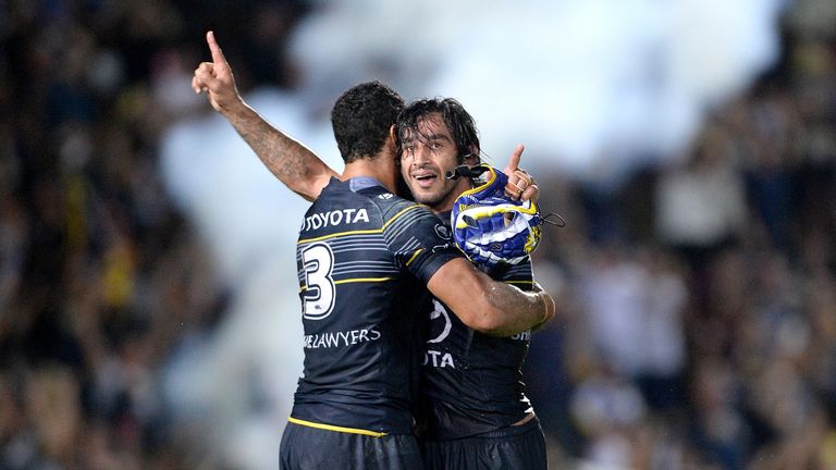 Johnathan Thurston and Justin O'Neill celebrate after North Queensland's extra-time win over Brisbane