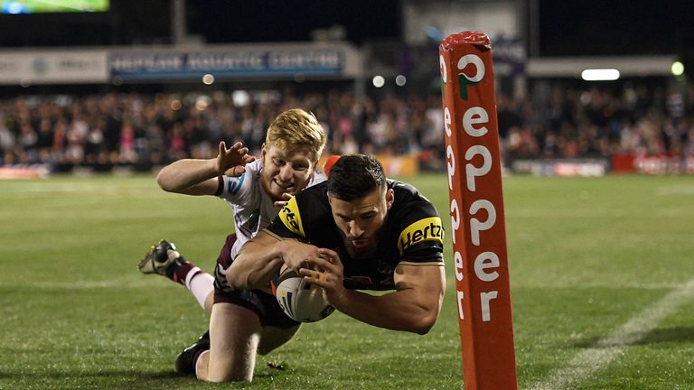 Joshua Mansour of the Penrith Panthers scores a try against the Manly Sea Eagles