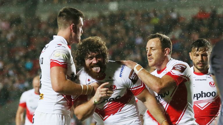 Kyle Amor celebrates scoring St Helens' third try against Castleford