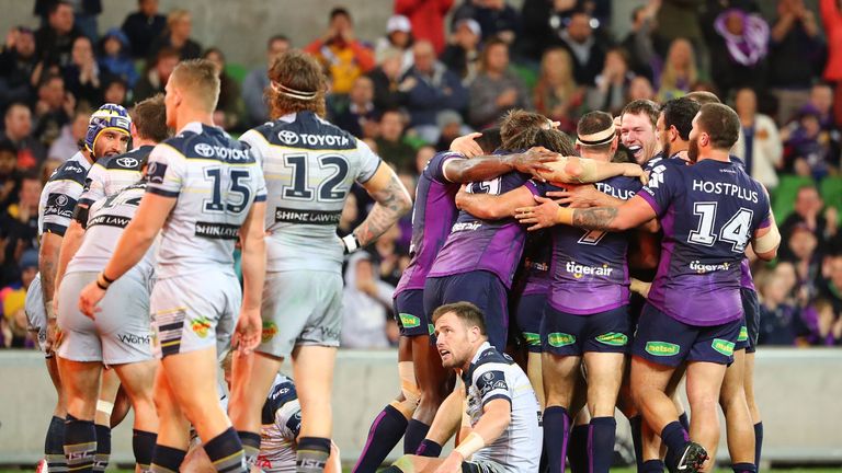 Jesse Bromwich is congratulated after scoring Melbourne's second try against North Queensland