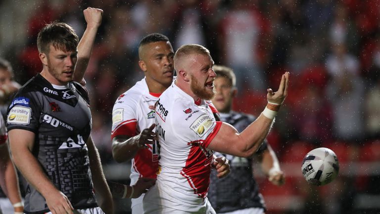 St Helens' Luke Thompson (right) celebrates his try against Castleford Tigers