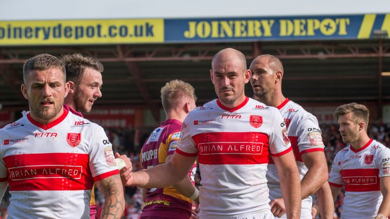 A dejected Ben Cockayne (left) and Terry Campese leave the field after Hull KR's loss to Huddersfield