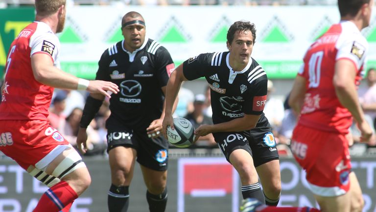 Matthieu Ugalde (middle) runs with the ball against Grenoble