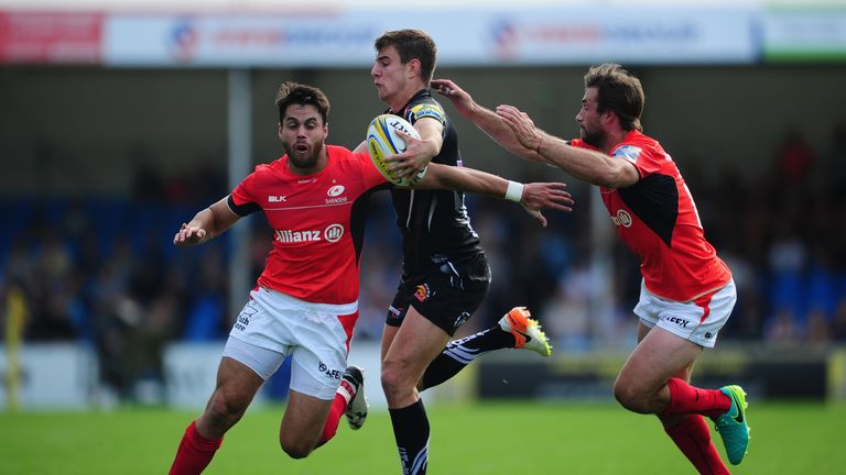 Ollie Devoto looks to break past Sean Maitland (left) and Marcelo Bosch of Saracens