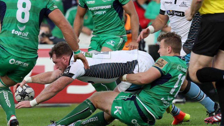 Stuart Hogg scores a try despite the tackle of Connacht's Matt Healy