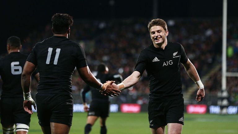 Beauden Barrett of New Zealand celebrates with Julian Savea