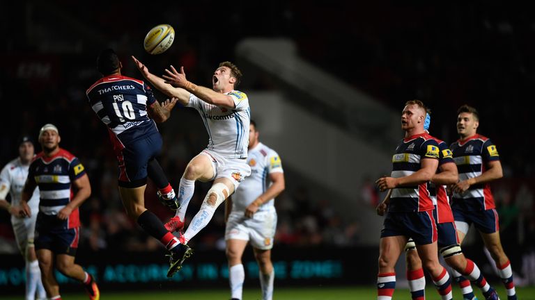 Will Chudley contests a high ball with Tusi Pisi of Bristol