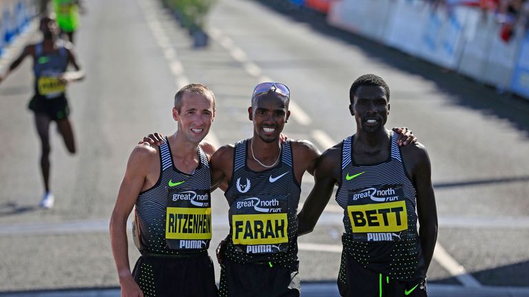 Mo Farah (centre) celebrated with runner-up Dathan Ritzenhein (Left) and third place Emmanuel Bett at teh Great North Run