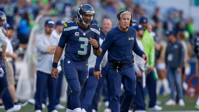 SEATTLE, WA - SEPTEMBER 25:  Quarterback Russell Wilson #3 of the Seattle Seahawks looks on from the sidelines after coming out of the game in the third qu