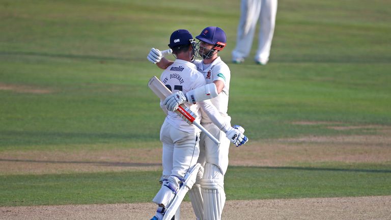 CHELMSFORD, ENGLAND - SEPTEMBER 13: Essex's Ryan ten Doeschate (L) and James Forster (R) celebrate the teams promotion during the Specsavers County Champio