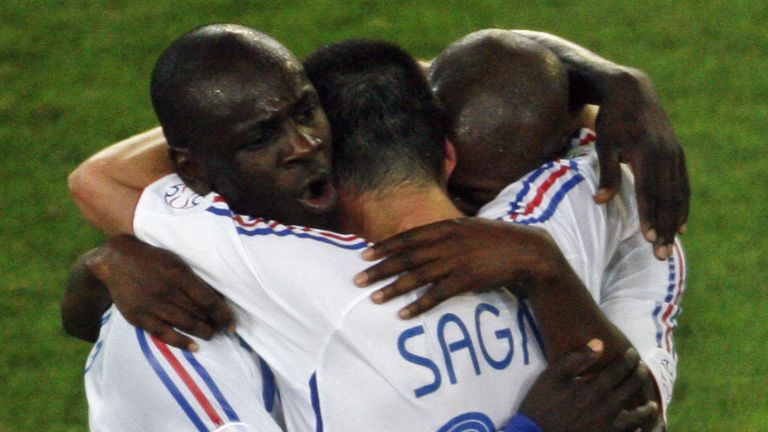 Hannover, GERMANY:  French defender Lilian Thuram (L) and teammate defender Willy Sagnol (C) celebrate at the end of the World Cup 2006 round of 16 footbal