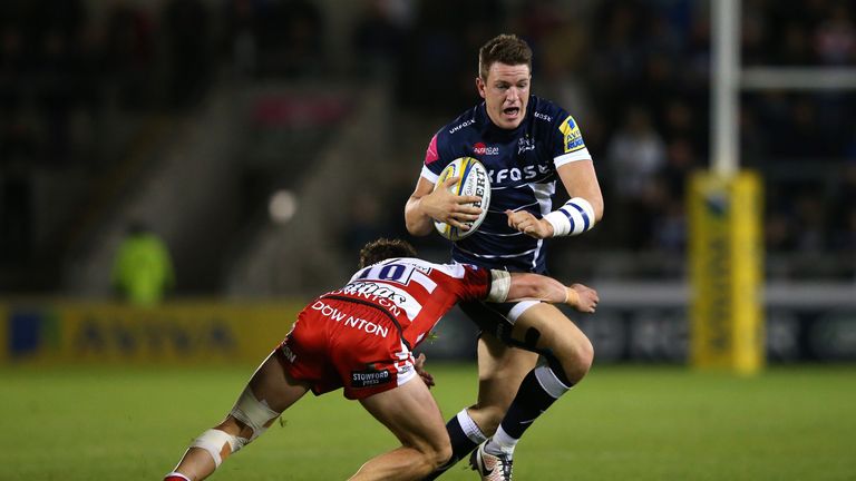 Sam James of Sale Sharks is tackled by Billy Burns of Gloucester Rugby 