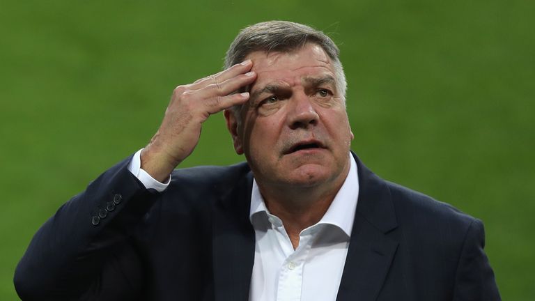 Manager Sam Allardyce rubs his forehead as he inspects the pitch prior to the FIFA World Cup Qualifying Group F match v Slovakia