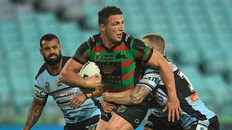 Sam Burgess (centre) in action for the South Sydney Rabbitohs