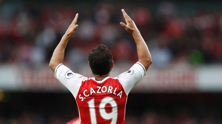 Santi Cazorla gestures during the Premier League match between Arsenal and Southampton