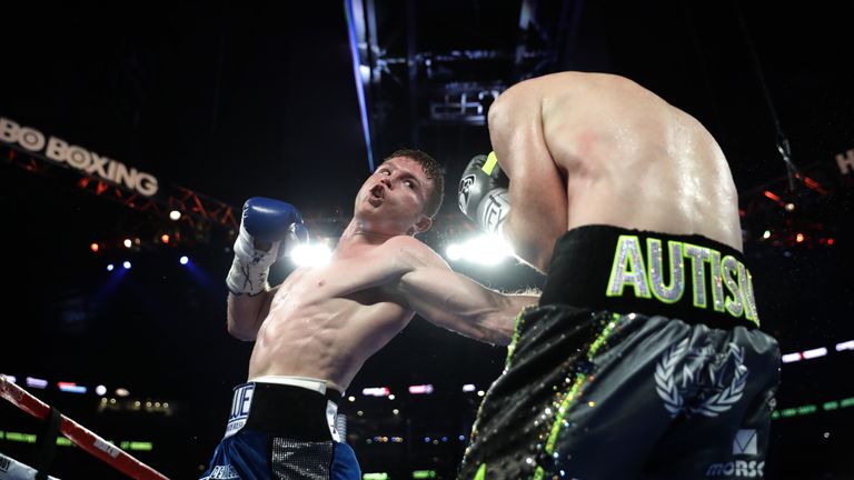 ARLINGTON, TX - SEPTEMBER 17: Canelo Alvarez, left, fights with Liam Smith, right, during the WBO Junior Middleweight World fight at AT&T Stadium on Septem