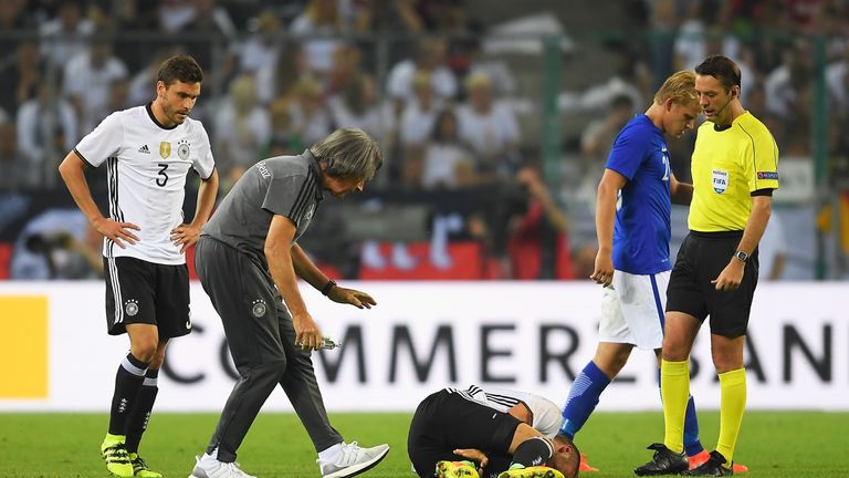 Germany's Shkodran Mustafi holds his leg earlier this week 