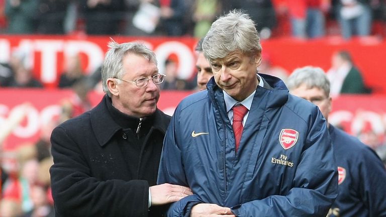 Sir Alex Ferguson of Manchester United and Arsene Wenger of Arsenal walk off