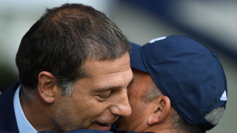 WEST BROMWICH, ENGLAND - SEPTEMBER 17: Manager of West Ham United, Slaven BiManager of West Ham United, Slaven Bilic(L) embraces Tony Pulis, Manager of Wes