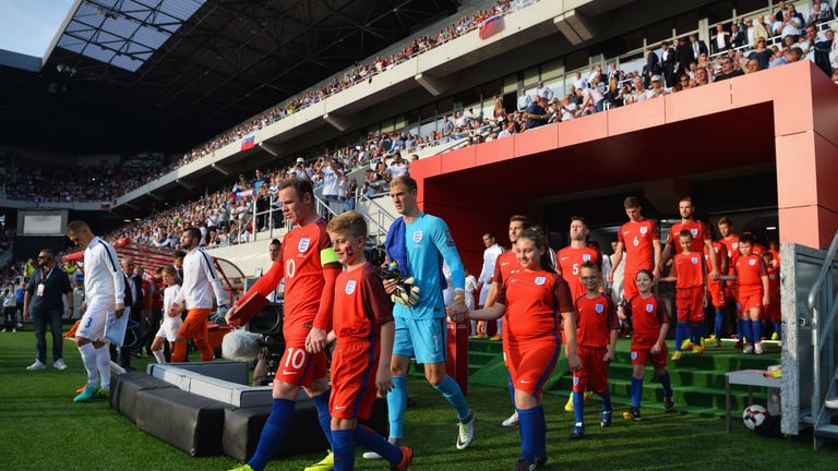 Wayne Rooney leads out England