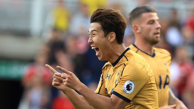 Son Heung-Min (L) celebrates scoring Tottenham's first goal