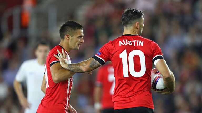 Austin argues with teammate Dusan Tadic over who takes the penalty