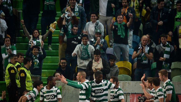 Sporting's Islam Slimani celebrates with his team-mates after scoring against FC Porto during the Portuguese league football match in March 2014