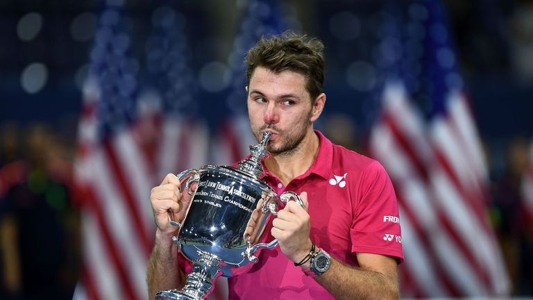 Stan Wawrinka of Switzerland kisses the championship trophy after defeating Novak Djokovic of Serbia in their 2016 US Open Men's Singles final match at the