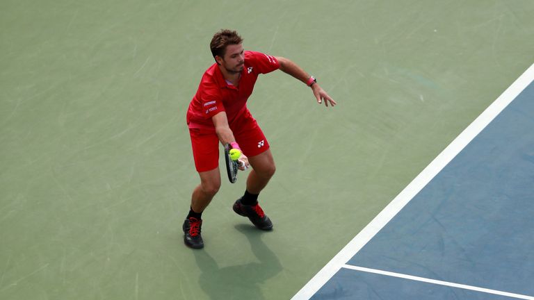 NEW YORK, NY - SEPTEMBER 05:  Stan Wawrinka of Switzerland returns a shot to Illya Marchenko of Ukraine during his fourth round Men's Singles match on Day 