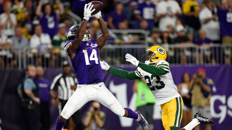 MINNEAPOLIS, MN - SEPTEMBER 18: Stefon Diggs #14 of the Minnesota Vikings makes a leaping catch for a touchdown over defender Damarious Randall #23 of the 