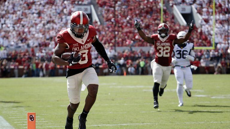 NORMAN, OK - OCTOBER 3:  Wide receiver Sterling Shepard #3 looks to score as running back Samaje Perine #32 of the Oklahoma Sooners  celebrates against the