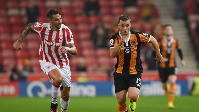 Shaun Maloney of Hull is tracked by Stoke's Geoff Cameron in the EFL Cup third round