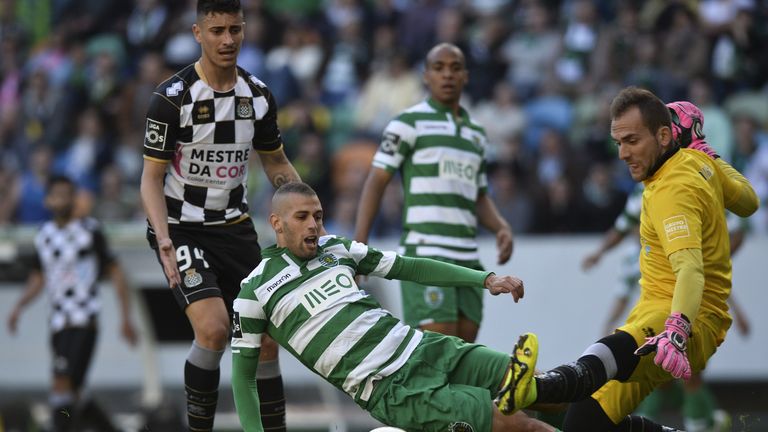 Sporting's Algerian forward Islam Slimani (2nd L) vies with Boavista's Swedish goalkeeper Michael Domingues "Mika" (R)