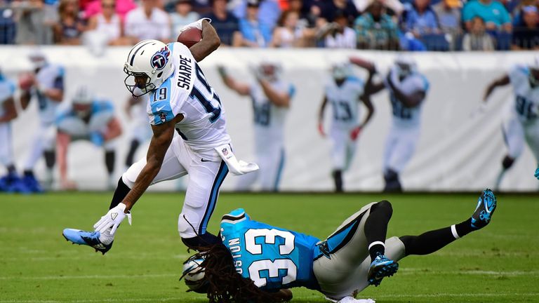 NASHVILLE, TN - AUGUST 20:  Tajae Sharpe #19 of the Tennessee Titans avoids a diving tackle by Tre Boston #33 of the Carolina Panthers during the first hal