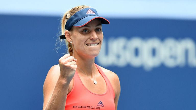 Angelique Kerber of Germany pumps her fist after winning against Roberta Vinci 